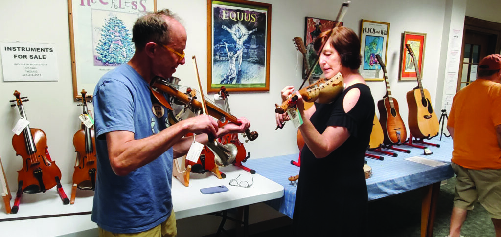 2024 Traditions Week instructors, Ken Kolodner and Mary Lynn Michal trying out instruments.  //  Photo by Maria Wong