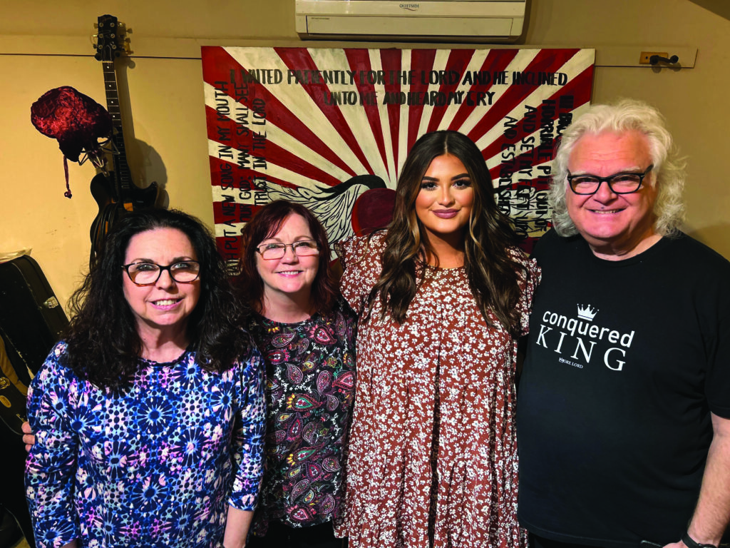 Jaelee Roberts with Cheryl White Jones, Sharon White Skaggs and Ricky Skaggs. //  Photo by Byron House