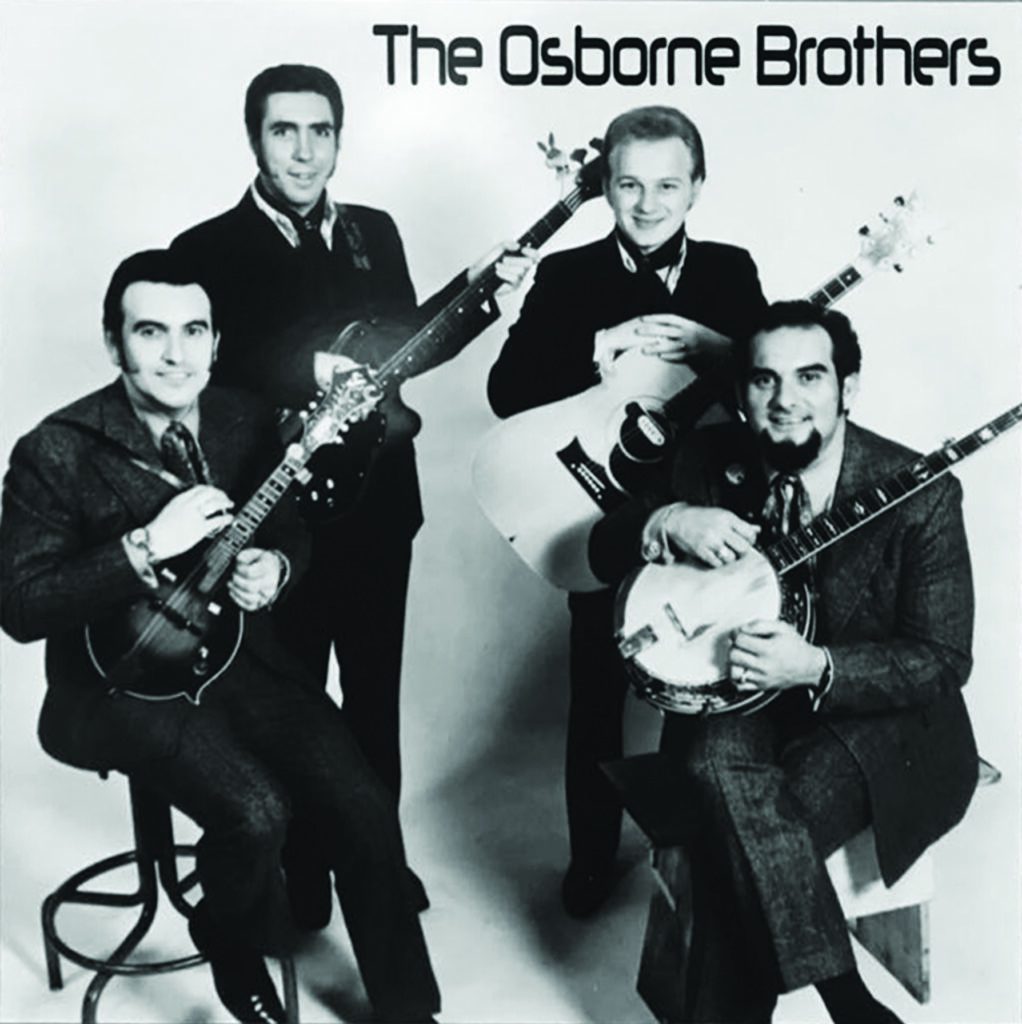 Ray Kirkland with the Osborne Brothers, ca. 1971. Front row, left to right: Bobby Osborne and Sonny Osborne. Back row, left to right: Ray Kirkland and Ronnie Reno.