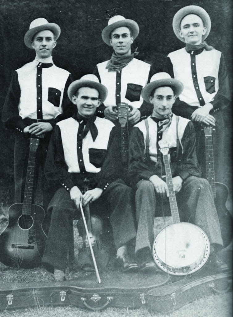 The Harmonizers, 1939 WDBJ Roanoke, Virginia. (left to right, standing) Lloyd Scott, Charlie Scott, Lester Flatt (seated) Lawrence Heron and Wallace Spicer. Bluegrass Unlimited Archives