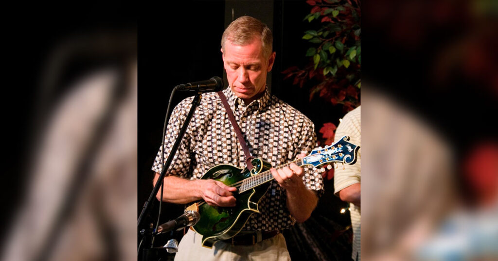 Skip Kelley playing one of this mandolins. // Photo courtesy of Skip Kelley