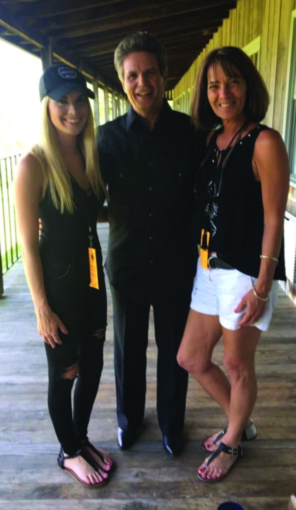 Mark with his wife and daughter (left to right) Carly Newton, Mark Newton and Tami Newton. // Photo by Cyndy Jurney