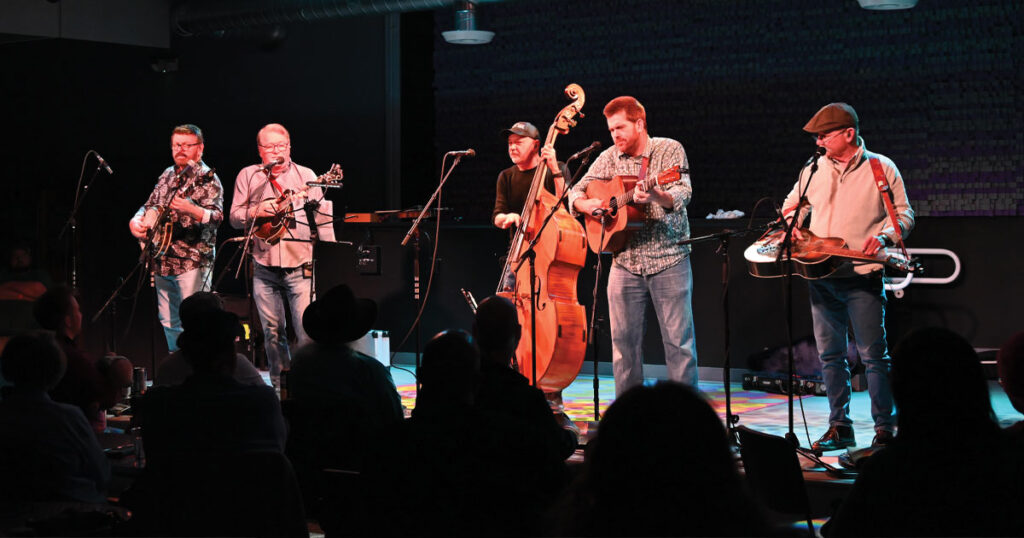 The Seldom Scene (right to left) Ron Stewart, Lou Reid, Ronnie Simpkins, Clay Hess and Fred Travers. | Photo by Kevin Slick
