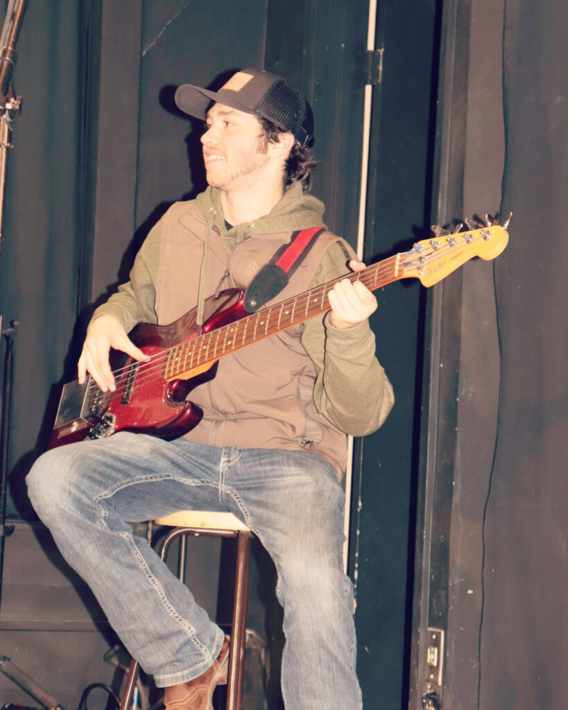 Elijah playing bass // Photo by Malinda Miller