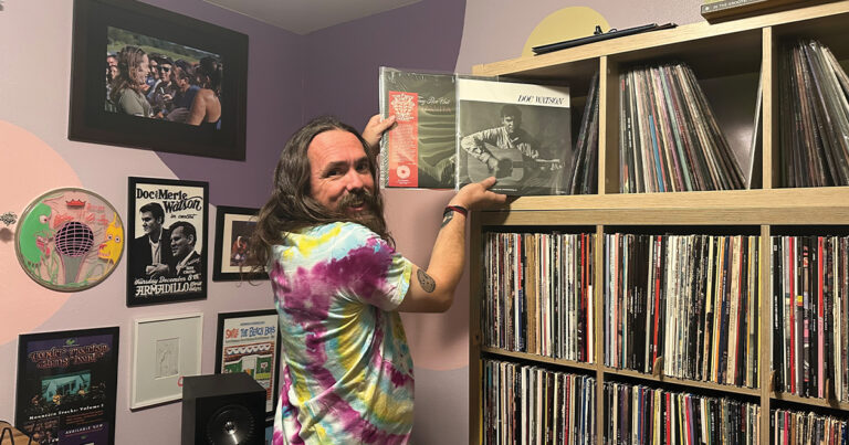 Kris Howland displays two of the albums he helped bring to vinyl