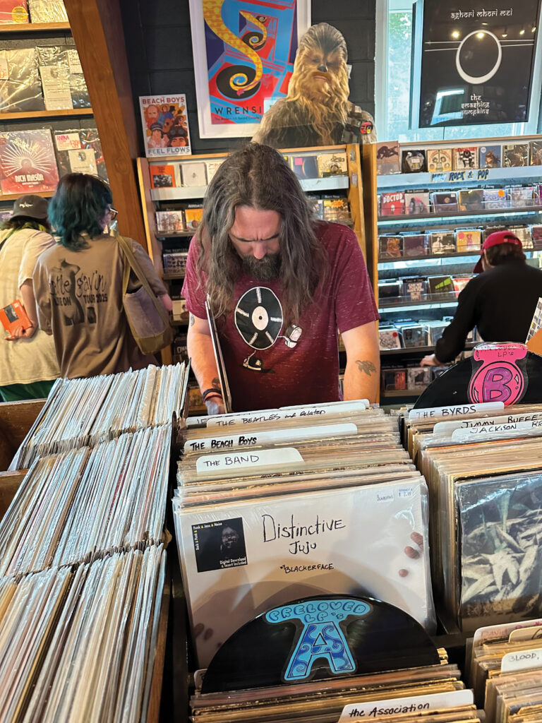 Kris Howland looking through the stacks