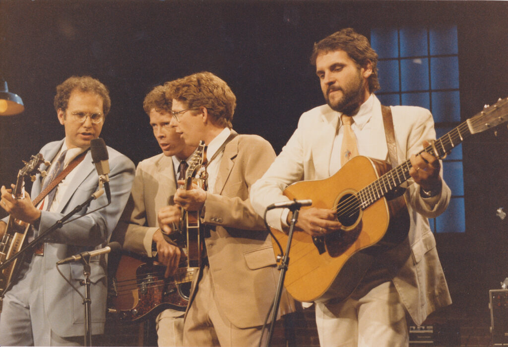Hot Rize performing on New Country, Nashville Network. 1985 (left to right) Pete Wernick, Nick Forster, Tim O’Brien and Charles Sawtelle.  
photo by Kathy Morgan
