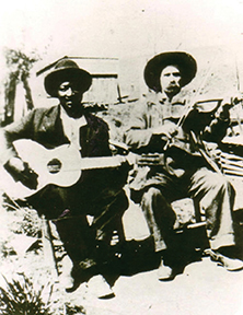 Arnold Shultz (left) with unknown musician (likely Pen Vandiver or Clarence Wilson).  Photo Bluegrass Music Hall of Fame & Museum collection.