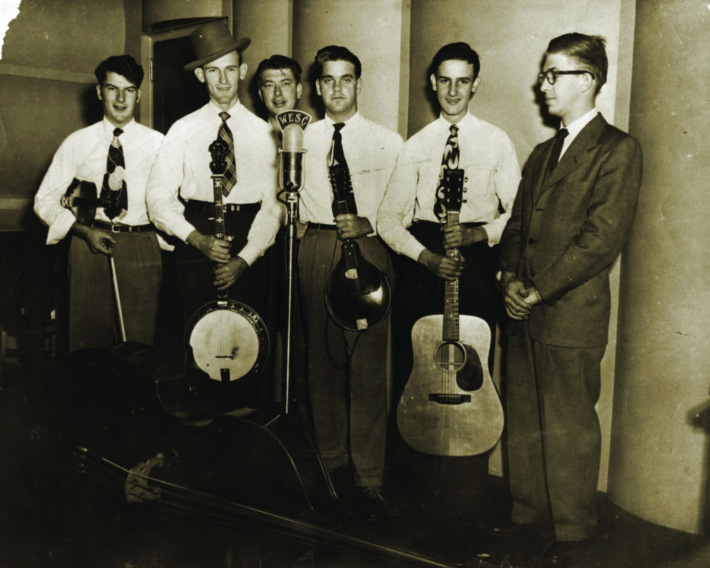 Don Reno and the Tennessee Cut Ups, 1949. (left to right) Jimmy Lunsford, Don Reno, Beemer Pruitt, Bill Haney, Verlon Reno, radio announcer unknown.  Photo Courtesy Reno Family/Jeremy Stephens Collection