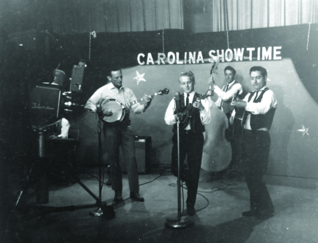Don Reno and the Tennessee Cut Ups on Carolina Showtime TV Set, WSPA TV Spartanburg, SC, early 1965. (left to right) Don Reno, Ronnie Reno, Duck Austin and Chuck Haney. Photo Courtesy Reno Family/Jeremy Stephens Collection