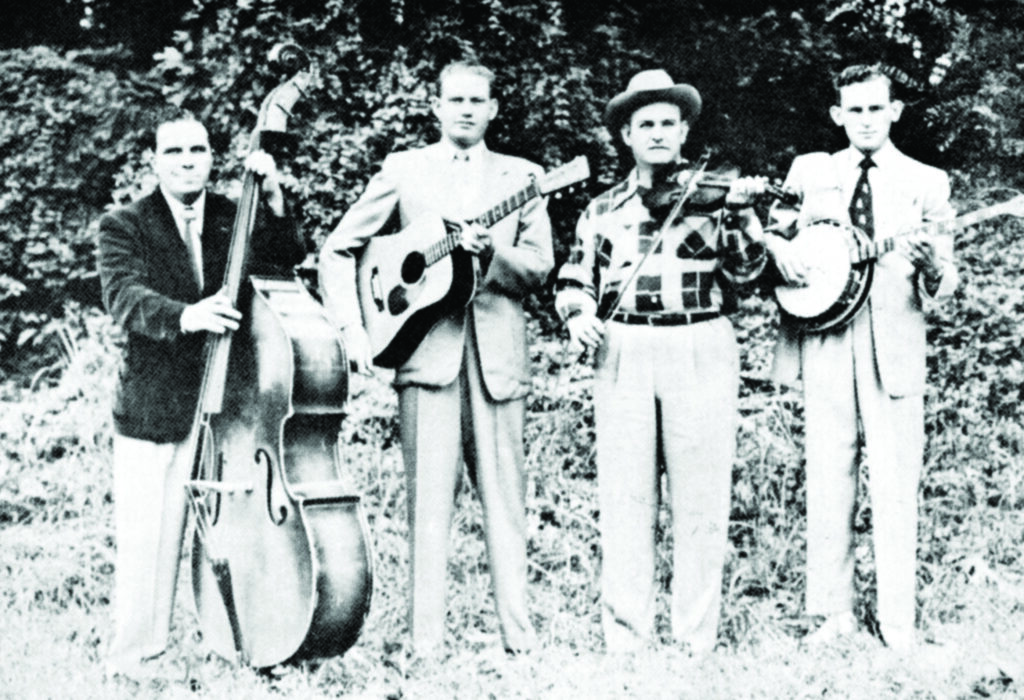 Tommy Magness and the Tennessee Buddies (left to right) Irving Sharp, Red Smiley, Tommy Magness and Don Reno.  Photo Bluegrass Unlimited Archives