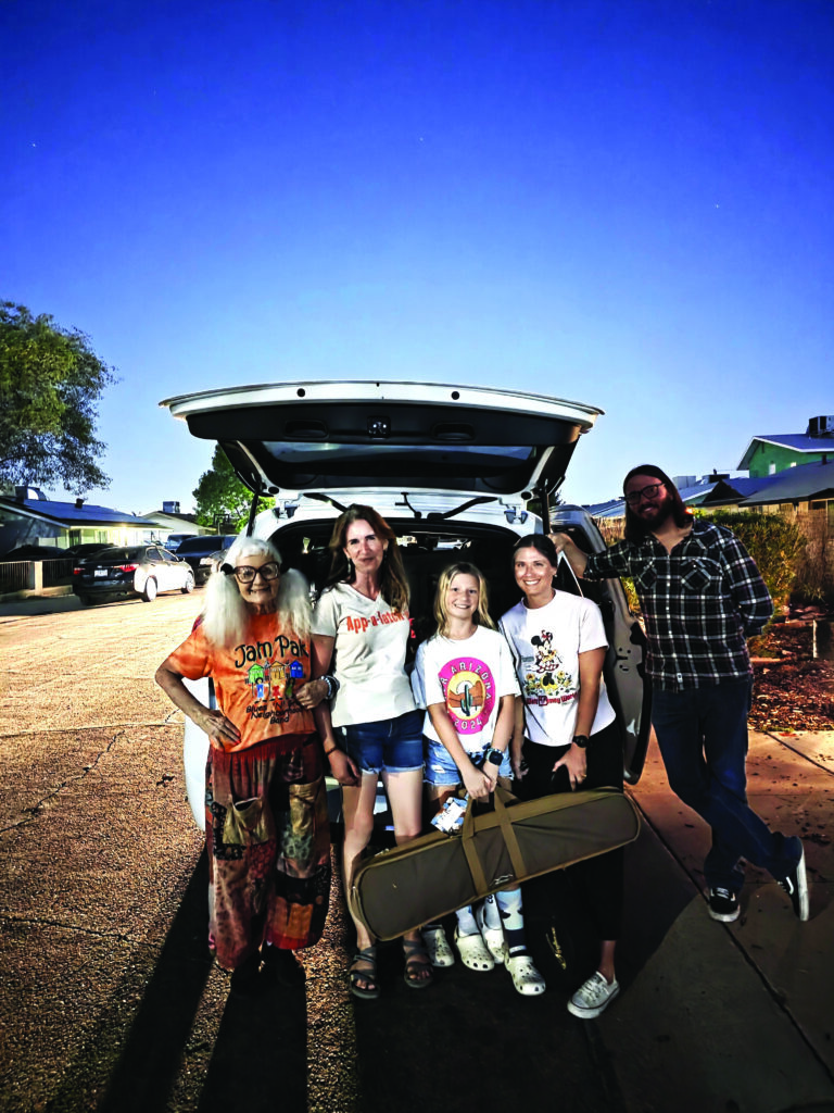 Members of the Jam Pak Blues ‘N’ Grass Neighborhood Band in Chandler, AZ, help Jam Pak and Junior Appalachian Musician directors Anni Beach (left) and Brett Morris pack up 43 donated, repaired instruments for their new J.A.M. friends in the Southeast U.S.
Photo by Blanche Fletcher, J.A.M.