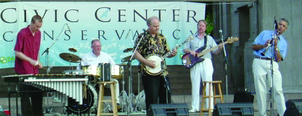 Pete Wernick & Flexigrass, 2005 in Denver. (left to right)  Greg Harris, Kris Ditson, Pete Wernick, Roger Johns, Bill Pontarelli [all still in the band]. Photo by  Joan Wernick