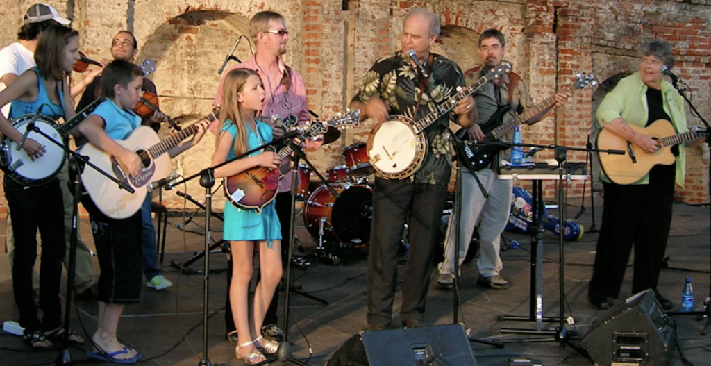 Pete and Joan Wernick performing in Vologda, Russia, 2010 with Russian youth band “Happy Stagecoach” and U.S. musicians Justin Hoffenberg and Robert Palomo.