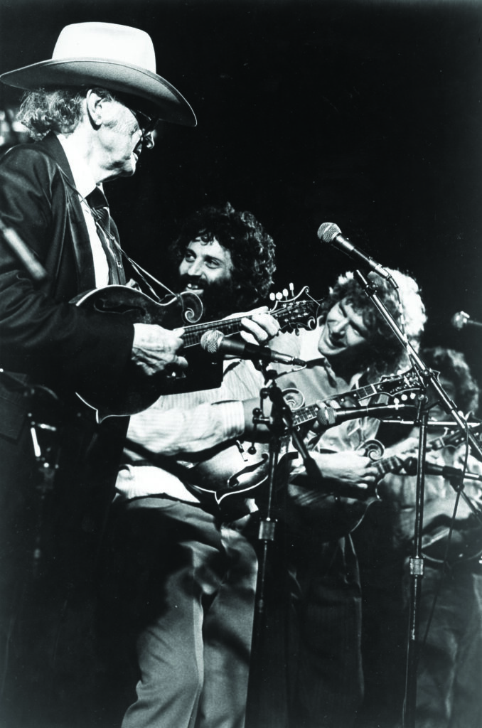 Bill Monroe, David Grisman, Sam Bush, and Mike Marshall at the Kentucky Fried Chicken Bluegrass Music Festival in Louisville, Kentucky.  Bluegrass Music Hall of Fame & Museum collection.
