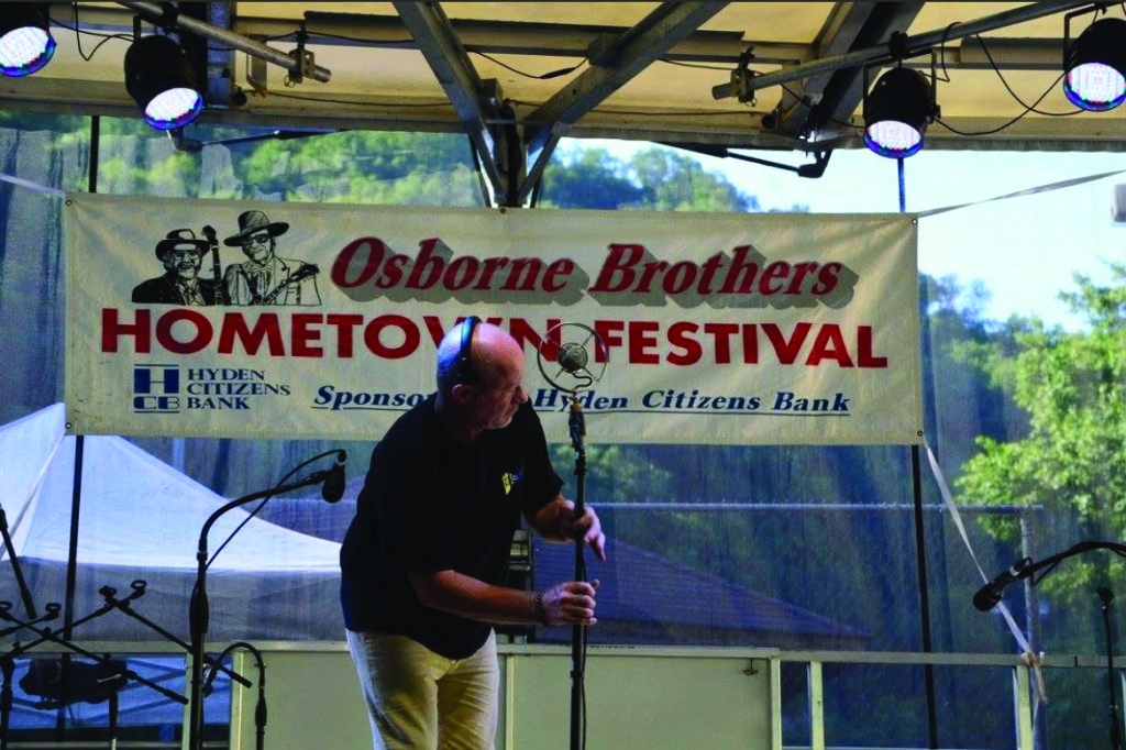 David setting up microphones at the Osborne Brothers Hometown Festival.