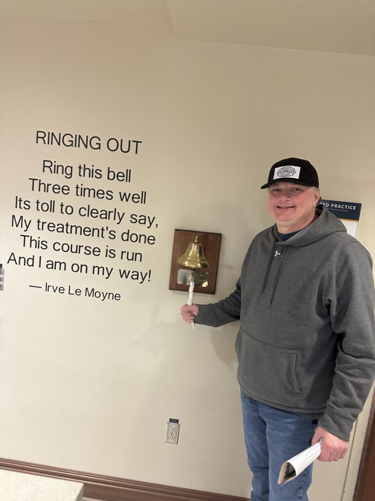 Nick Chandler ringing the bell. // Photo by Trudy Chandler