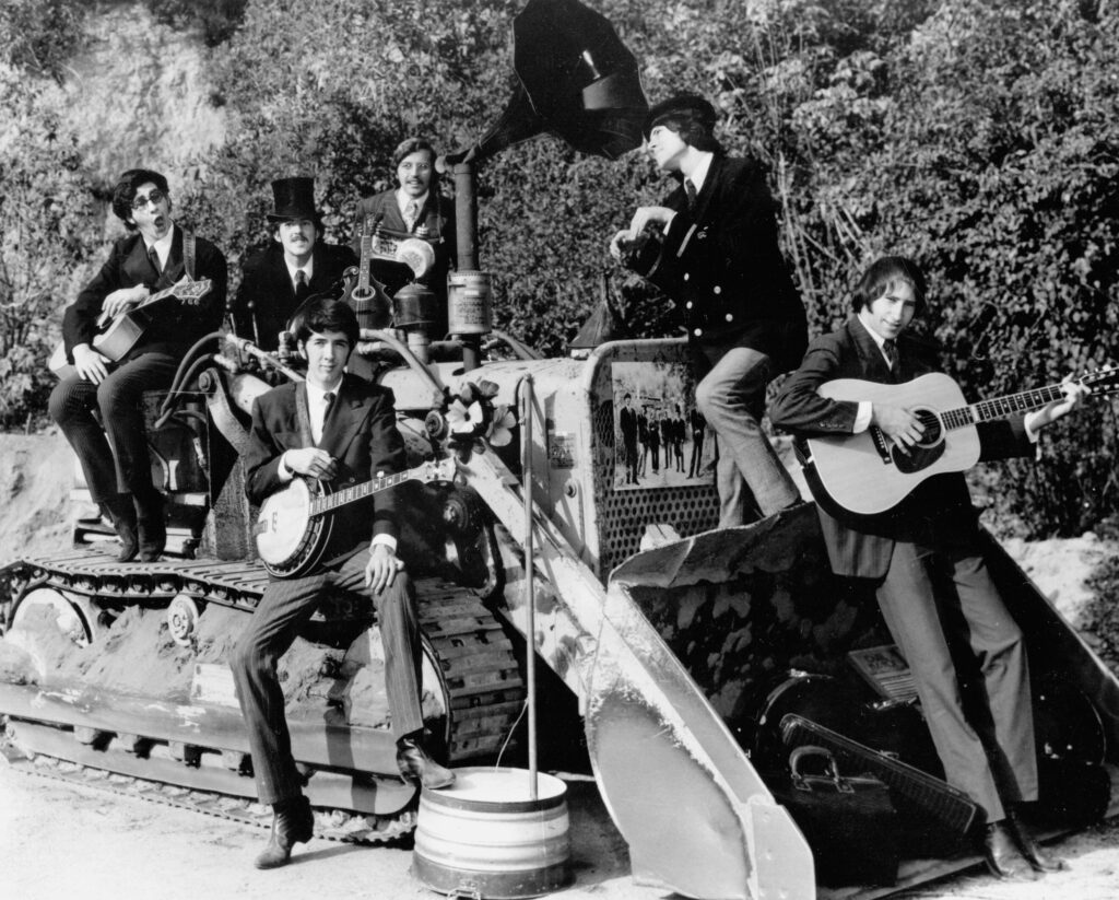 The Nitty Gritty Dirt Band, a photo out-take from their first album photo session, circa, 1966 (Left to Right) Back Row: Ralph Barr, Les Thompson, Jeff Hanna. Front Row: John McEuen, Jimmie Fadden, Bruce Kunkel. // Photo by John A. Stewart