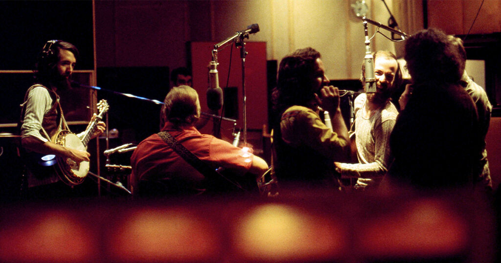 The Nitty Gritty Dirt Band recording with Jimmy Martin for the Will the Circle Be Unbroken album. (Left to Right) John McEuen, Jimmy Martin, Jeff Hanna, Les Thompson, Ray Martin, Gary Scruggs. // Photo by William E. McEuen