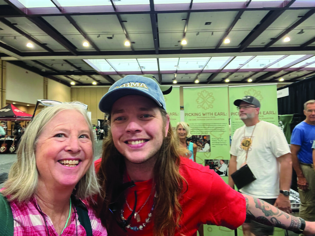 Christine Funk, Thompson Guitars General Manager, with Billy Strings. // photo By Christine Funk