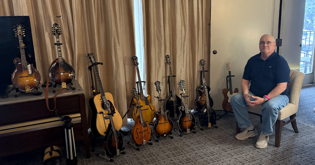 Steve Hinde at the SPBGMA event in Nashville with a selection of instruments that he has built. // Photo by Keith Yoder