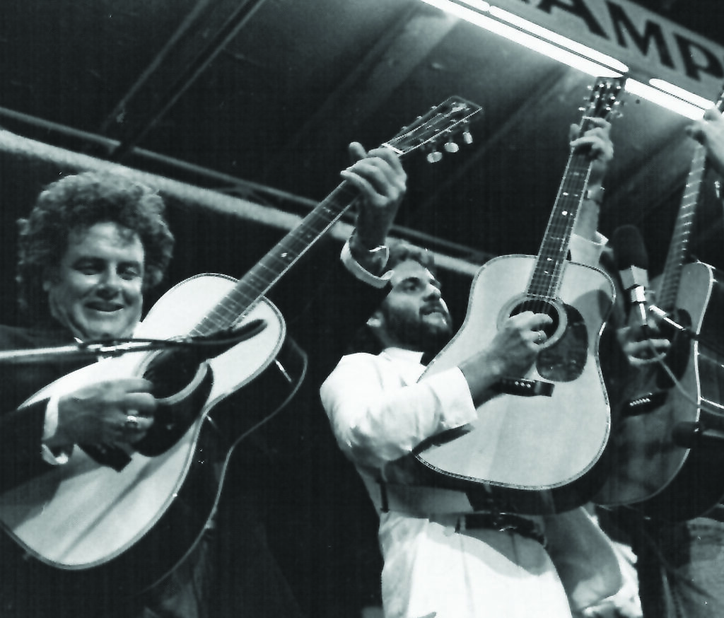 Peter Rowan and Charles Sawtelle playing their Preston Thompson guitars at the Walnut Valley Festival in Winfield, Kansas.
