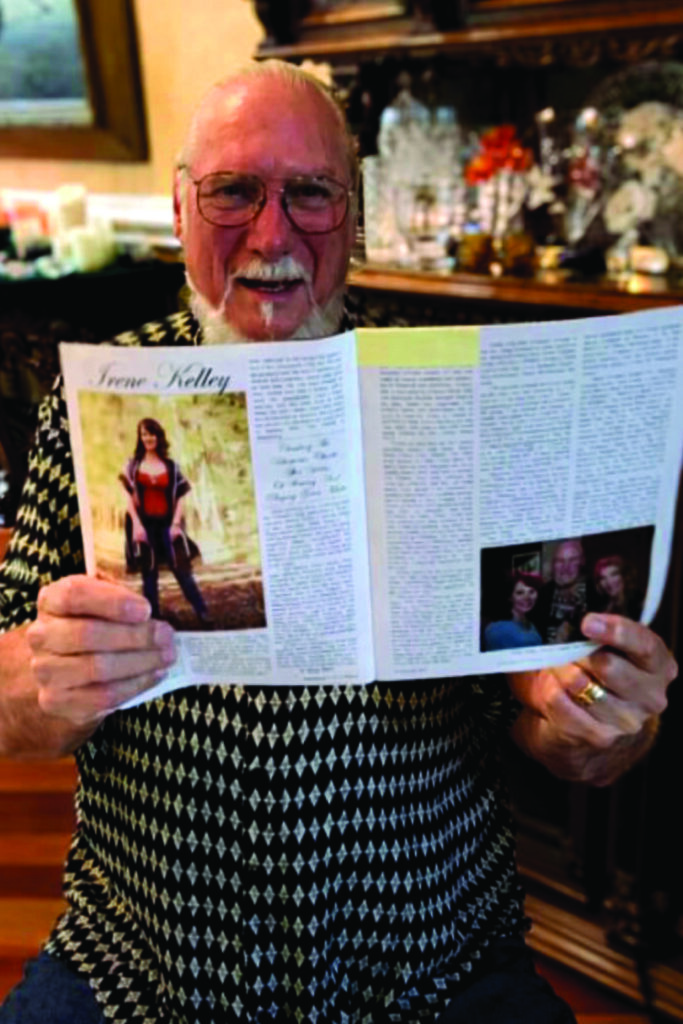Steve Crooper holding a up the Bluegrass Unlimited Magazine article that featured Irene Kelly. 
Photo by Justyna Kelley